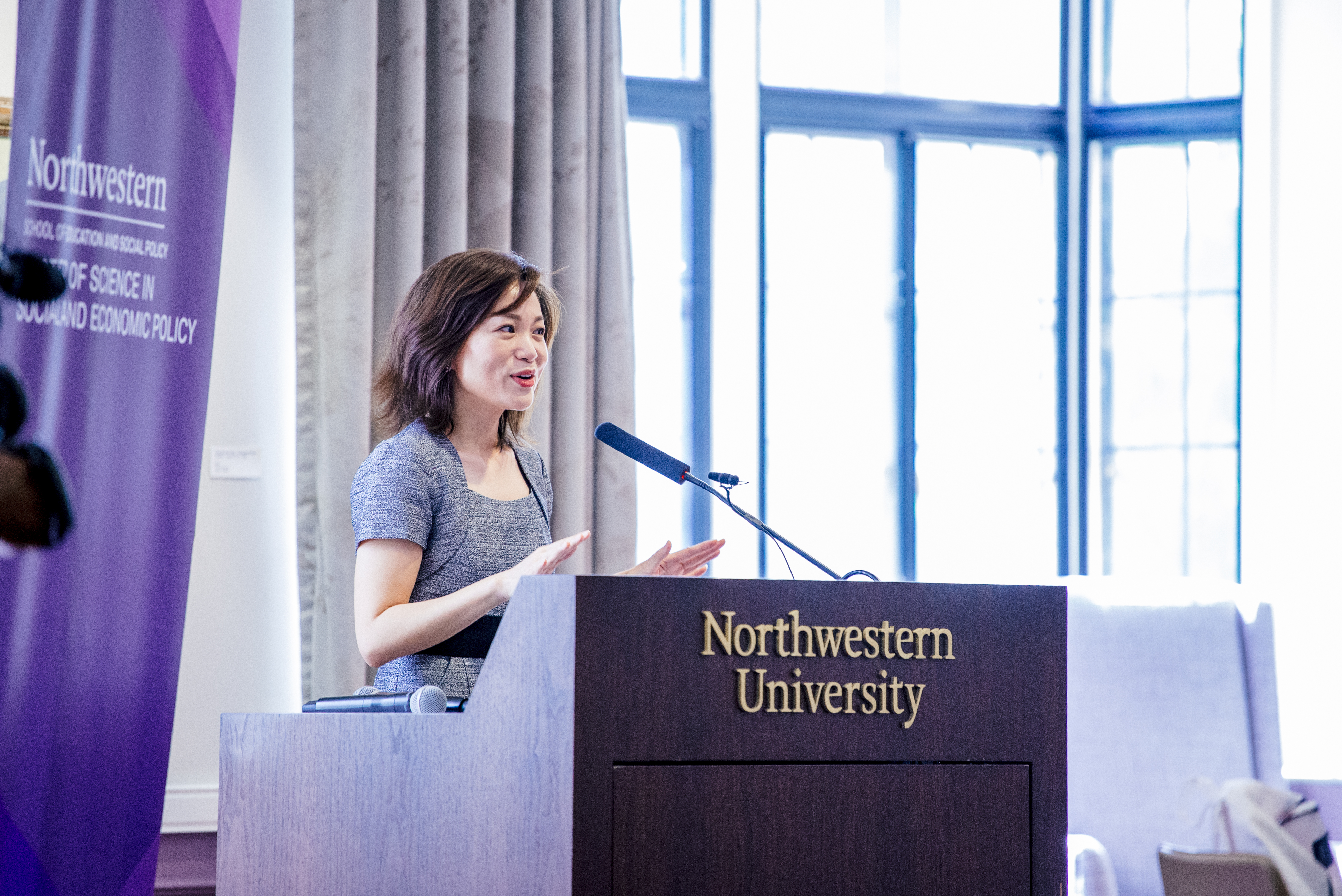 Dr. Michelle Yin speaking at Northwestern University podium