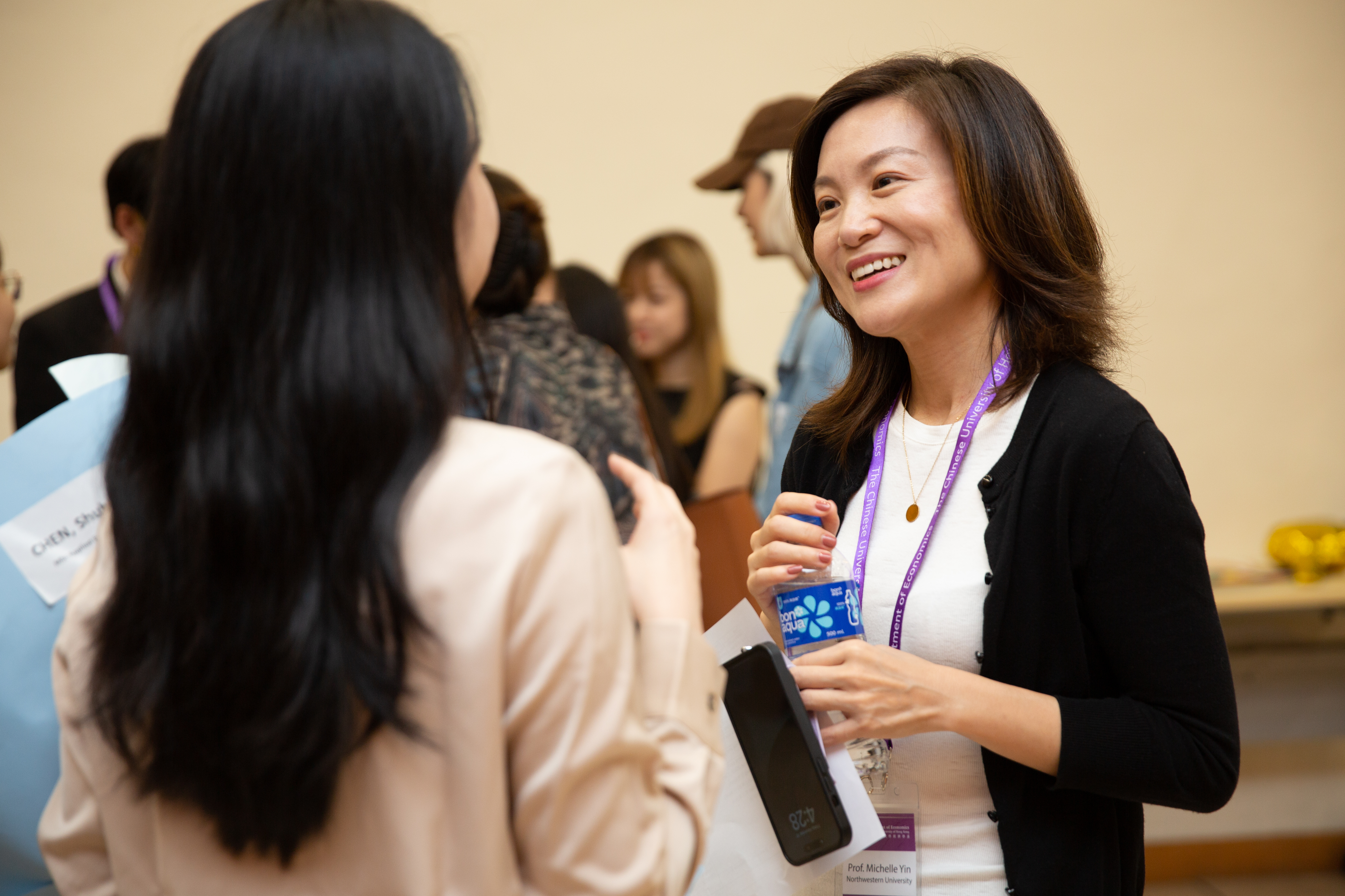 Faculty-student conversation at DMDP reception
